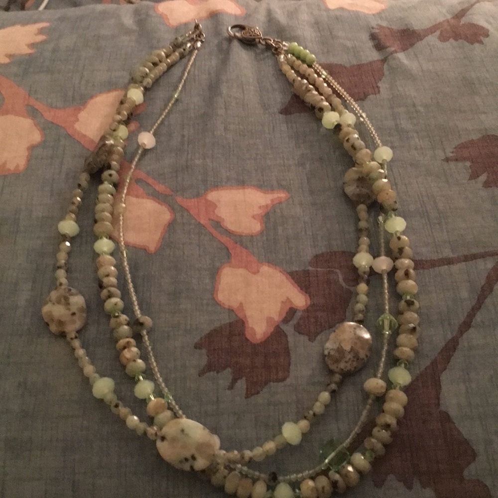 Three strand beaded necklace.